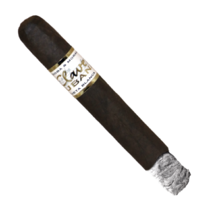 A 'Clave Blanca' cigar with a glowing ash tip and a gold and white label.